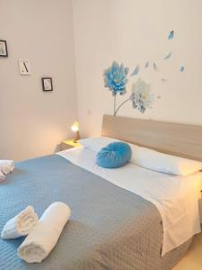 Postel nebo postele na pokoji v ubytování F.A.M. ROOMS