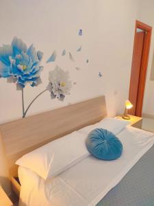 Postel nebo postele na pokoji v ubytování F.A.M. ROOMS
