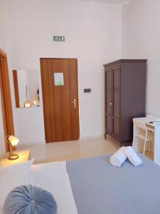 Postel nebo postele na pokoji v ubytování F.A.M. ROOMS