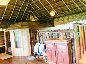 a room with a cabin with a table and chairs at Cinnabar Resort in Tangalle