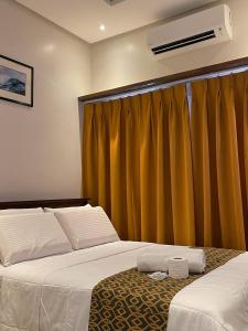 Katil atau katil-katil dalam bilik di White Sand Bar Inn