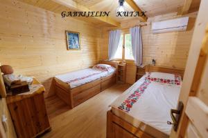 Postel nebo postele na pokoji v ubytování Gabrielin kutak