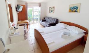 Postel nebo postele na pokoji v ubytování Apartments Marino