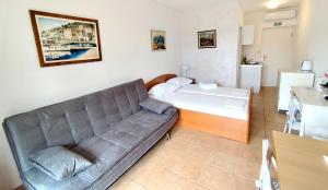 Postel nebo postele na pokoji v ubytování Apartments Marino