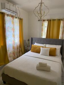 A bed or beds in a room at Seabliss Villa