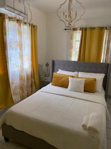 A bed or beds in a room at Seabliss Villa