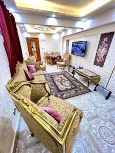 a living room with a couch and a table at Sporting star in Alexandria