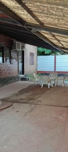 a group of chairs sitting in a parking lot at De la Sierra in Sierra de la Ventana +5 photos