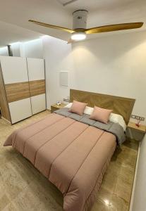 Postel nebo postele na pokoji v ubytování Apartamento céntrico cerca de Torres de Serrano y Viveros