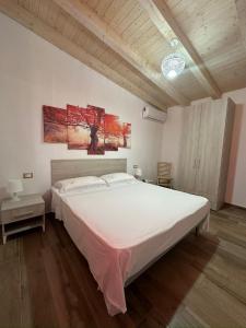 Ένα ή περισσότερα κρεβάτια σε δωμάτιο στο Giò House Lampedusa -Mamalù