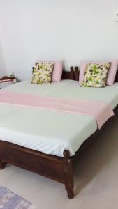 Postel nebo postele na pokoji v ubytování New Manik Homestay