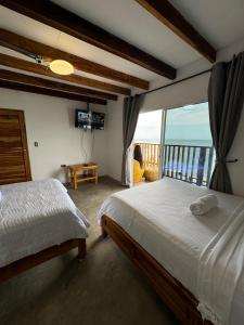 Postel nebo postele na pokoji v ubytování Cabañas W Beach
