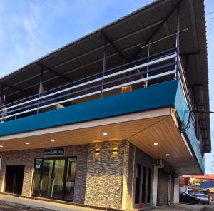 a building with a balcony on top of it at Grand Luxury Hotel Semporna in Semporna