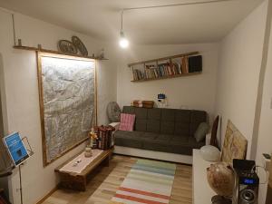 a living room with a couch and a table at Appartamento montano in Druogno