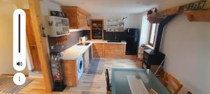 a kitchen with a table and a counter top at Appartamento montano in Druogno