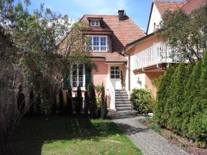 a house with a pathway in front of it at Romantikappartements Staufen in Staufen im Breisgau