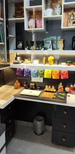 a counter in a store with many differentiatesiatesiatesiatesiatesiatesiatesiates at The Great Escape - Rustic Countryside Stay in Amritsar +20 photos