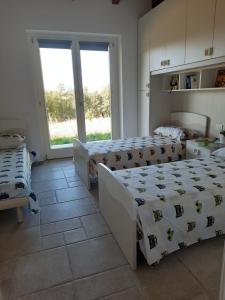 Postel nebo postele na pokoji v ubytování VILLA MILLEFIORI