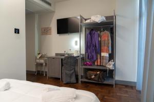 Postel nebo postele na pokoji v ubytování Hotel Ambrosiano + 21 fotografií
