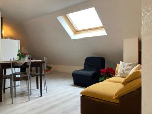 a living room with a skylight and a table and a couch at Da Bruna in Fiuggi