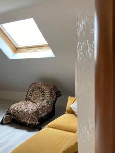 a bedroom with a bed and a skylight at Da Bruna in Fiuggi