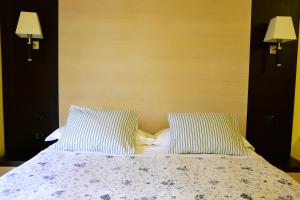 Posteľ alebo postele v izbe v ubytovaní Villa Nina