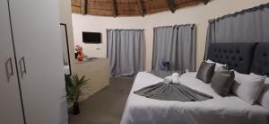 Ένα ή περισσότερα κρεβάτια σε δωμάτιο στο Risima Guest Lodge Hazyview