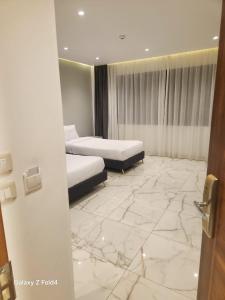 Voodi või voodid majutusasutuse El Mesaadya Hotel فندق المساعدية toas