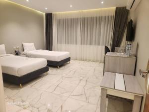 Voodi või voodid majutusasutuse El Mesaadya Hotel فندق المساعدية toas