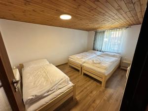 Postel nebo postele na pokoji v ubytování Apartmány Pieniny