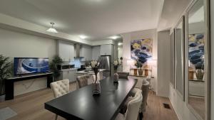 a kitchen and dining room with a table and chairs at Ivylea Elegant Luxury Estate Richmond Hill in Richmond Hill +62 photos