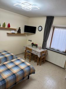 Łóżko lub łóżka w pokoju w obiekcie Casa Norberto