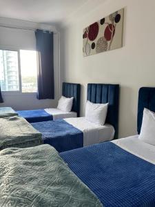Postel nebo postele na pokoji v ubytování Penthouse malabata