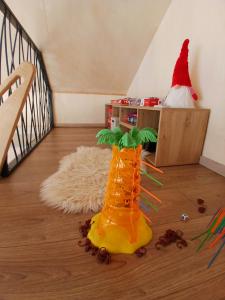 a santa hat and a yellow boot on the floor at Vikendica Planinski san Blidinje in Rudo Polje