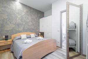 Postel nebo postele na pokoji v ubytování Al Baglio 2