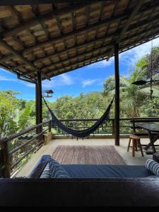 a hammock on the deck of a villa at Casa do Noé in Paraty