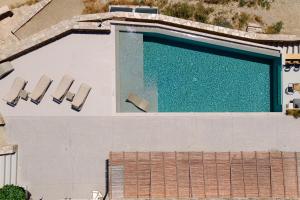 an overhead view of a swimming pool at On The Rocks - The Pebbles - Serviced Villas in Ios Chora