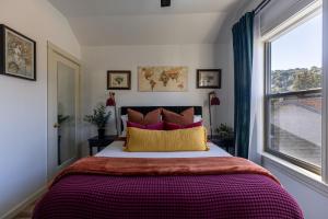 a bedroom with a large bed and a window at Victorian House-30 mins to Napa & SF, Free Pets! in Crockett