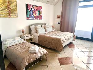 Postel nebo postele na pokoji v ubytování Amarin Pisa Room
