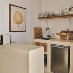 a kitchen with a sink and a counter top at Herdade d' Amoreira Lavanda Villa in Aljezur +55 photos