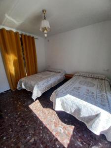 Postel nebo postele na pokoji v ubytování casa del cura + 2 fotografie
