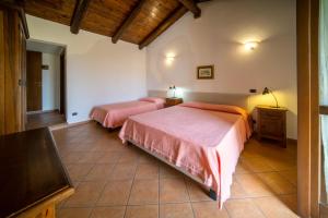 Postel nebo postele na pokoji v ubytování Agriturismo Le Viole