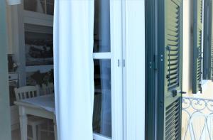 a door leading to a room with a table at My Place Your Place in Corniglia +36 photos