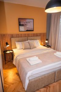 Ένα ή περισσότερα κρεβάτια σε δωμάτιο στο Pelagonka Central Apartment +31 φωτογραφίες