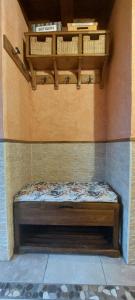 a small bed in a corner of a room at La Cabaña in Mozoncillo de Juarros