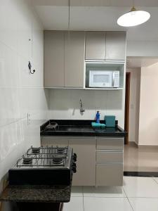 Η κουζίνα ή μικρή κουζίνα στο Flat 715 norte