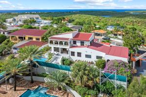 an aerial view of a resort with palm trees at Million dollar view Spanish Hacienda Style Luxury Villa in Jan Thiel in Jan Thiel