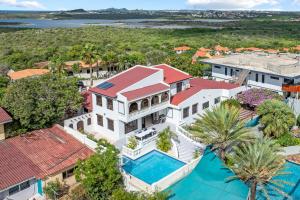 an aerial view of a house with a swimming pool at Million dollar view Spanish Hacienda Style Luxury Villa in Jan Thiel in Jan Thiel