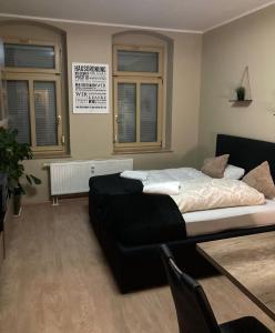 Postel nebo postele na pokoji v ubytování Adam's Pension