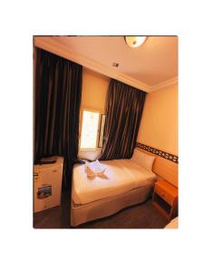 Postel nebo postele na pokoji v ubytování فندق كرمك مكةhotelkaramak